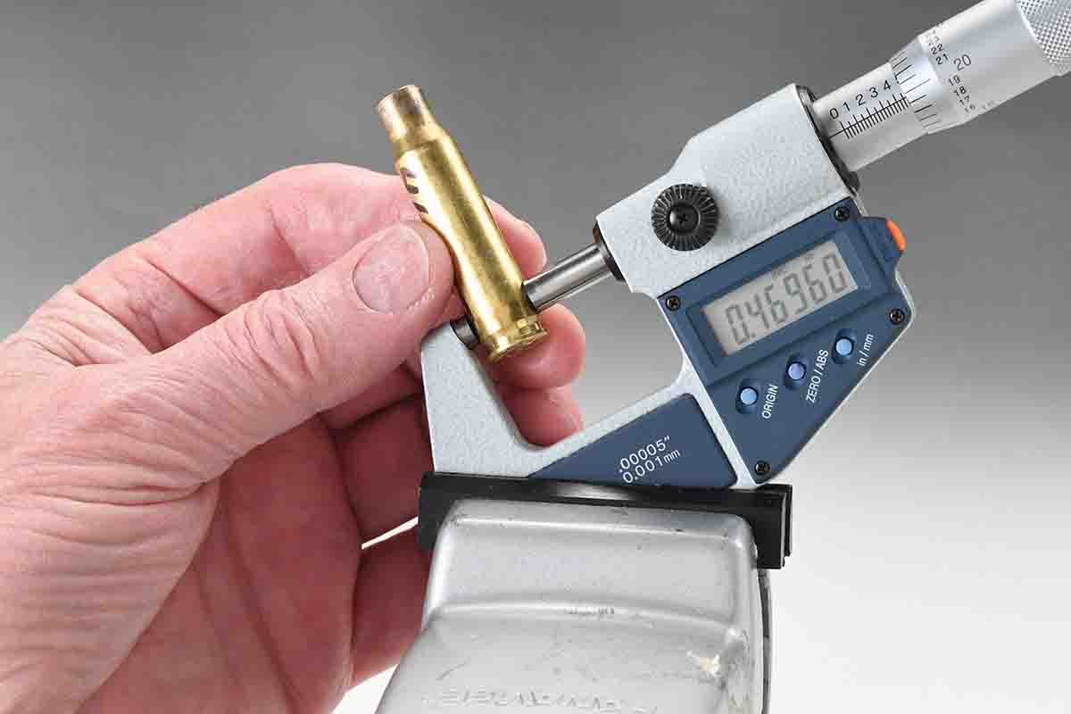 If measuring the projecting expansion ring rather than the web, it can be done with a conventional micrometer with normal anvils. A small vise to hold the micrometer is an aid.